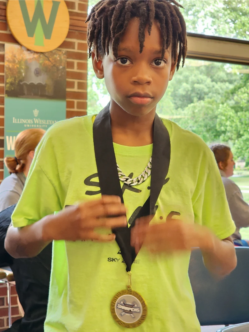 Young Wrestler flaunting his medal 