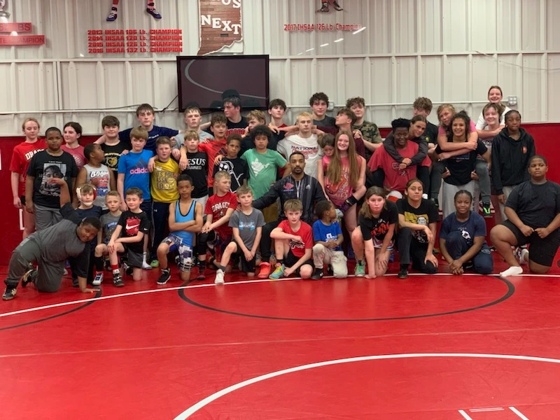 Group of young academy wrestlers posing for a photo