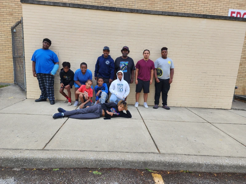 A group of young kids posing for a photo